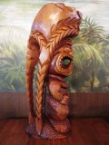 Milo Ku with three carved braids